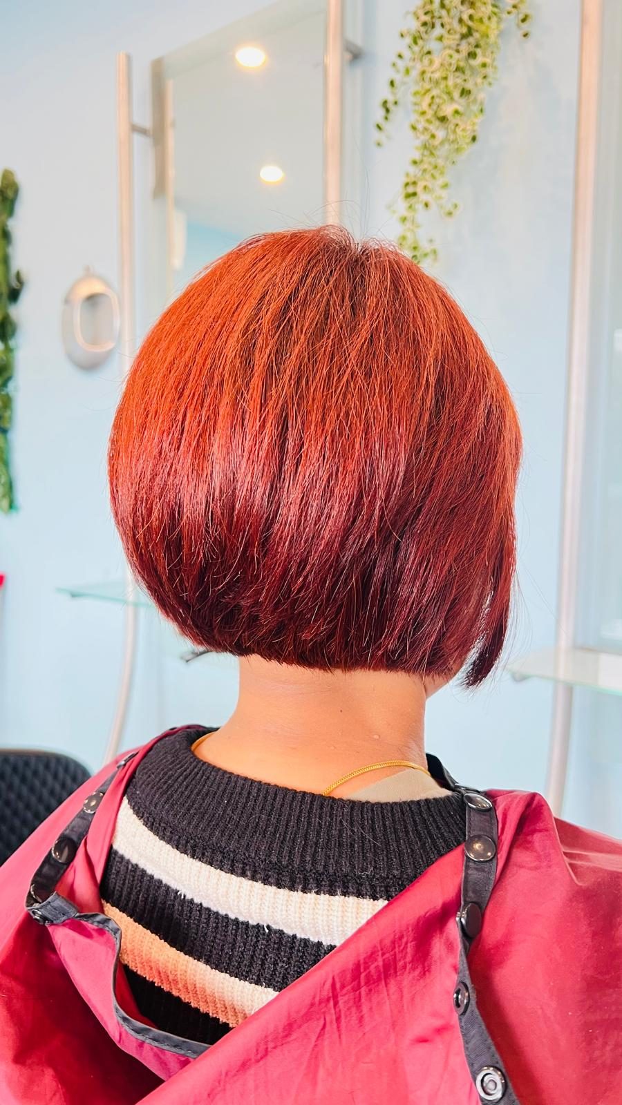 Glossy red bob haircut created at Lahana Hair and Beauty