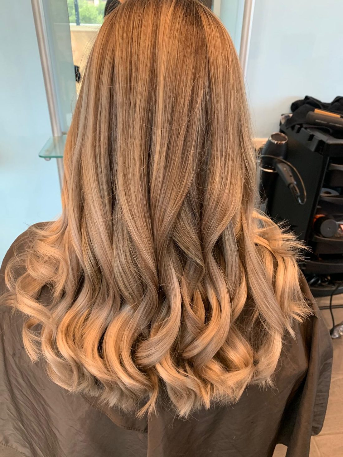 Warm balayage and soft waves created at Lahana Hair and Beauty